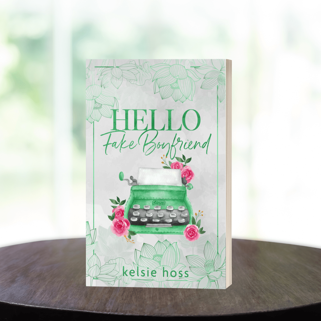 a paperback showing a green typewriter, titled Hello Fake Boyfriend by Kelsie Hoss