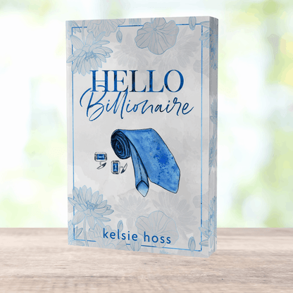 a paperback copy of Hello Billionaire by Kelsie Hoss, the cover features a rolled-up tie 