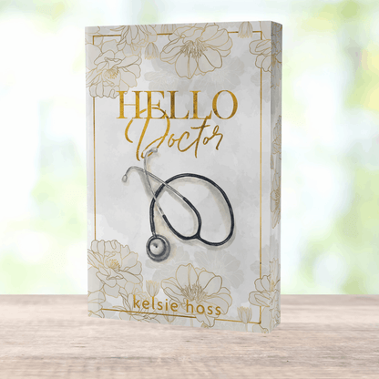 a paperback copy of Hello Doctor by Kelsie Hoss, the cover features a stethoscope 