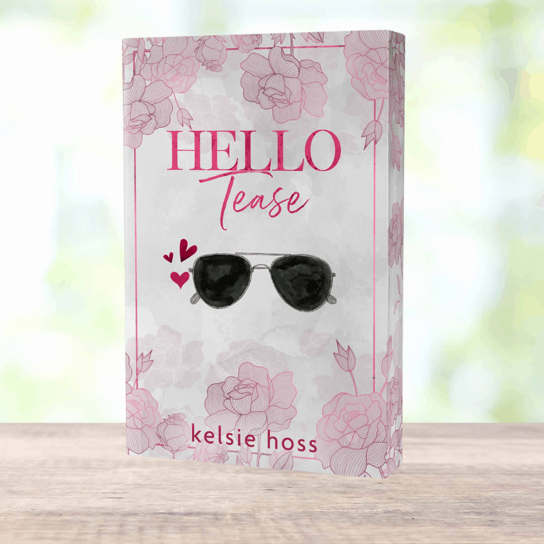 a paperback copy of Hello Tease by Kelsie Hoss, the cover features a pair of sunglasses 