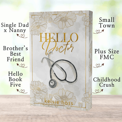 A paperback copy of Hello Doctor with book tropes listed, which are: Single Dad x Nanny, Brother's Best Friend, Hello Book Five, Small Town, Plus Size FMC, Childhood Crush