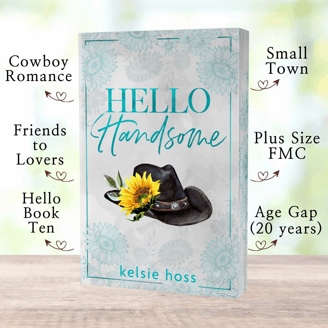 A paperback copy of Hello Handsome with book tropes listed, which are: Small Town, Plus Size FMC, Age Gap (20 Years), Cowboy Romance, Friends to Lovers, Hello Book Ten