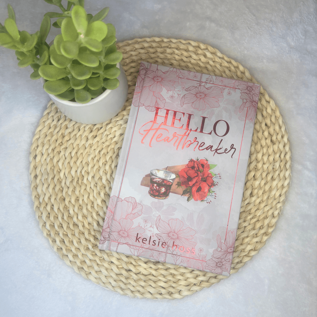 "Hello Heartbreaker" sits on a mat next to a succulent 