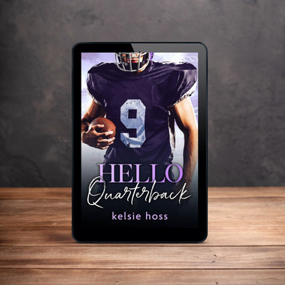 An ebook reader is shown on a table. It's cover shows a man in football gear holding a football. The book is titled Hello Quarterback by Kelsie Hoss