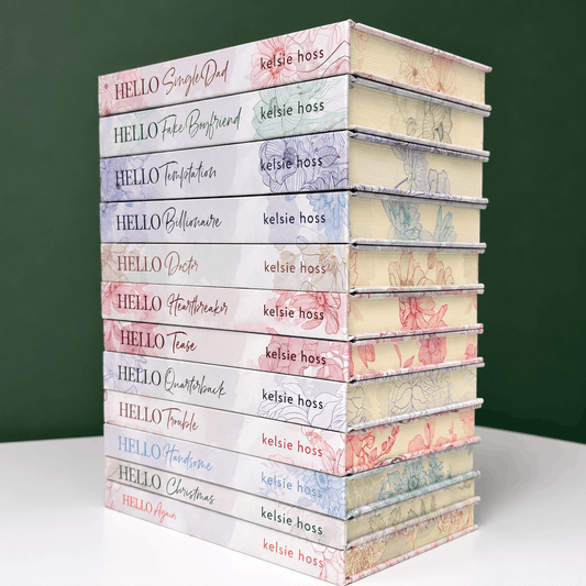A stack of special edition hardcover copies of The Hello Series by Kelsie Hoss, with light covers and sprayed floral designed edges