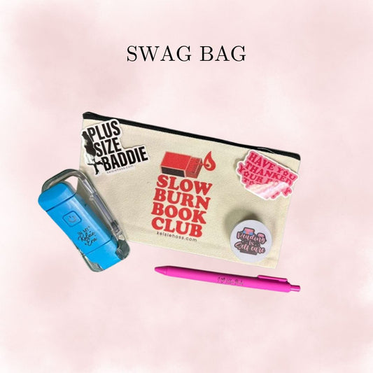 The image shows the contents of a SWAG BAG . Including a ballpoint pen, a sticker that reads plus size birdie, a sticker that reads slow burn book club, a reading light and two additional stickers